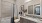 bathroom with a large mirror and ample lighting